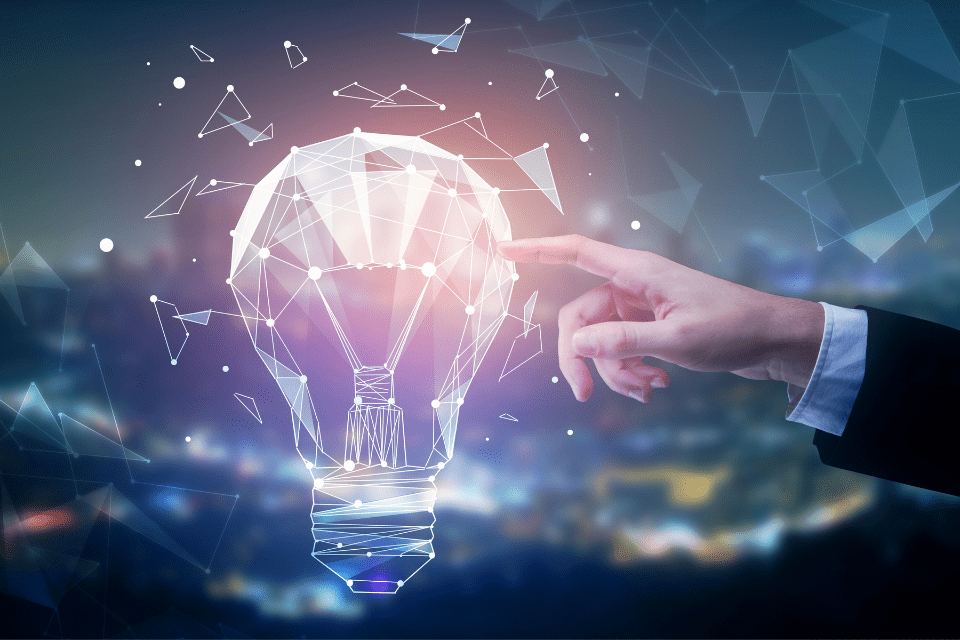 A finger touches an illustration of a lightbulb