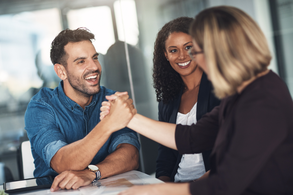 coworkers shake hands
