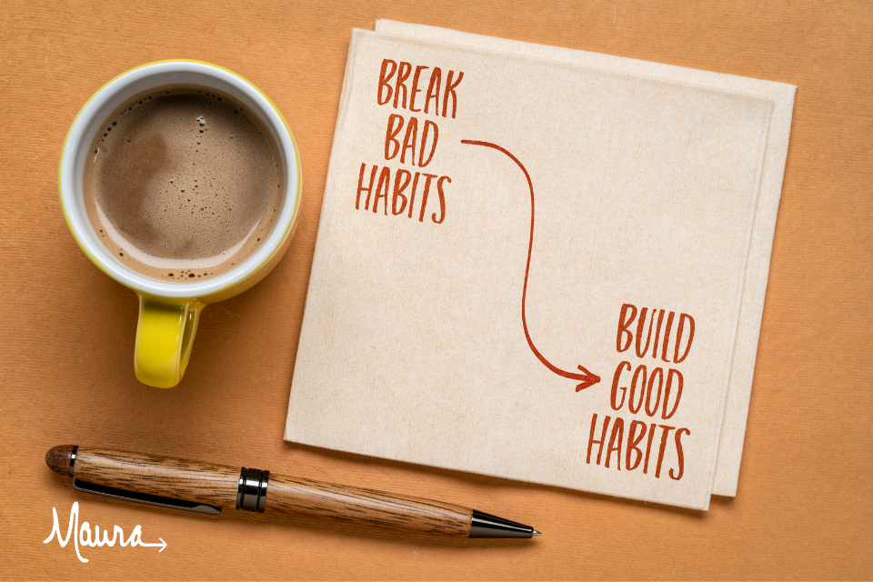 On napkin is written "Break bad habits" and "Build good habits" There is also a coffee cup.