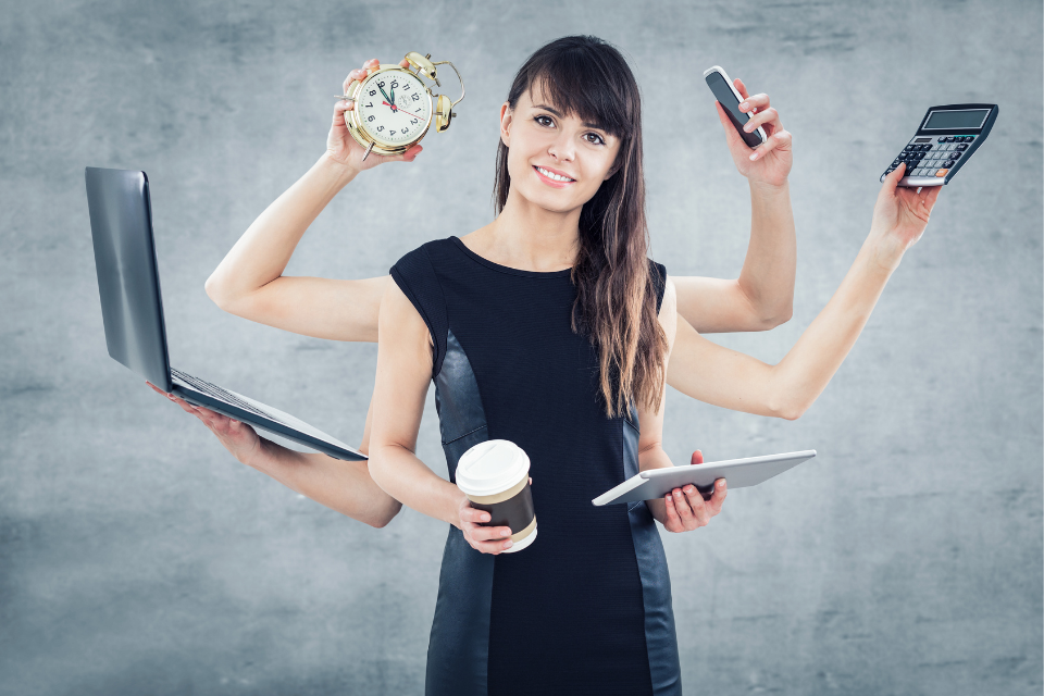 A woman with many arms holds coffee, clock, cell phone, laptop, tablet