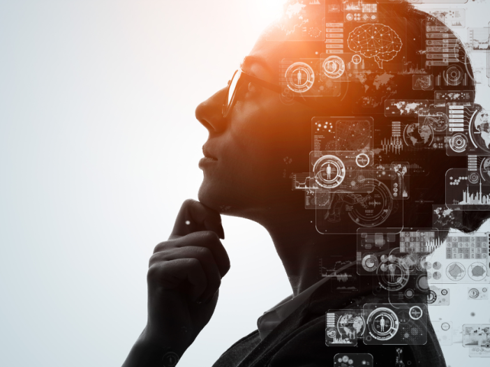 Profile of a woman's head with technology sybols superimposed on top